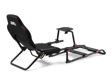 Cockpit infantil dobrável Next Level Racing GTLite Junior com criança a pilotar